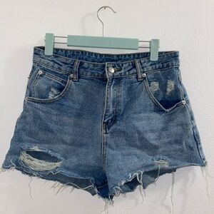 Princess Polly size ripped up denim shorts with raw hem size 6